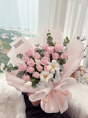 Fresh Pink/White Roses wrapped in pink paper